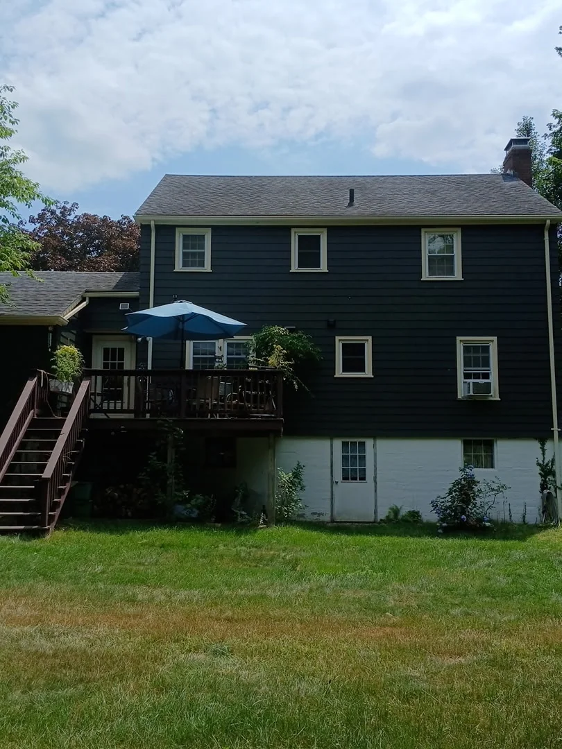 Same home after exterior painting, photographed from a different angle