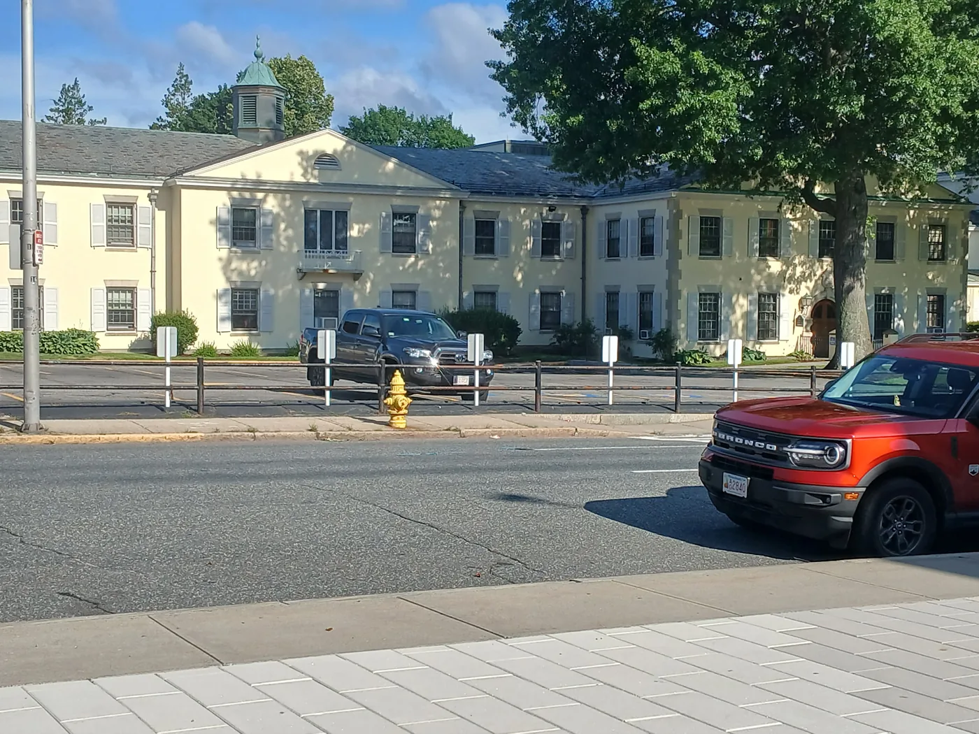 Large cream commercial building after exterior painting