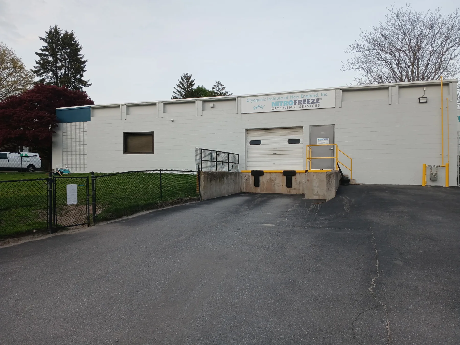 Commercial industrial building with freshly painted light exterior