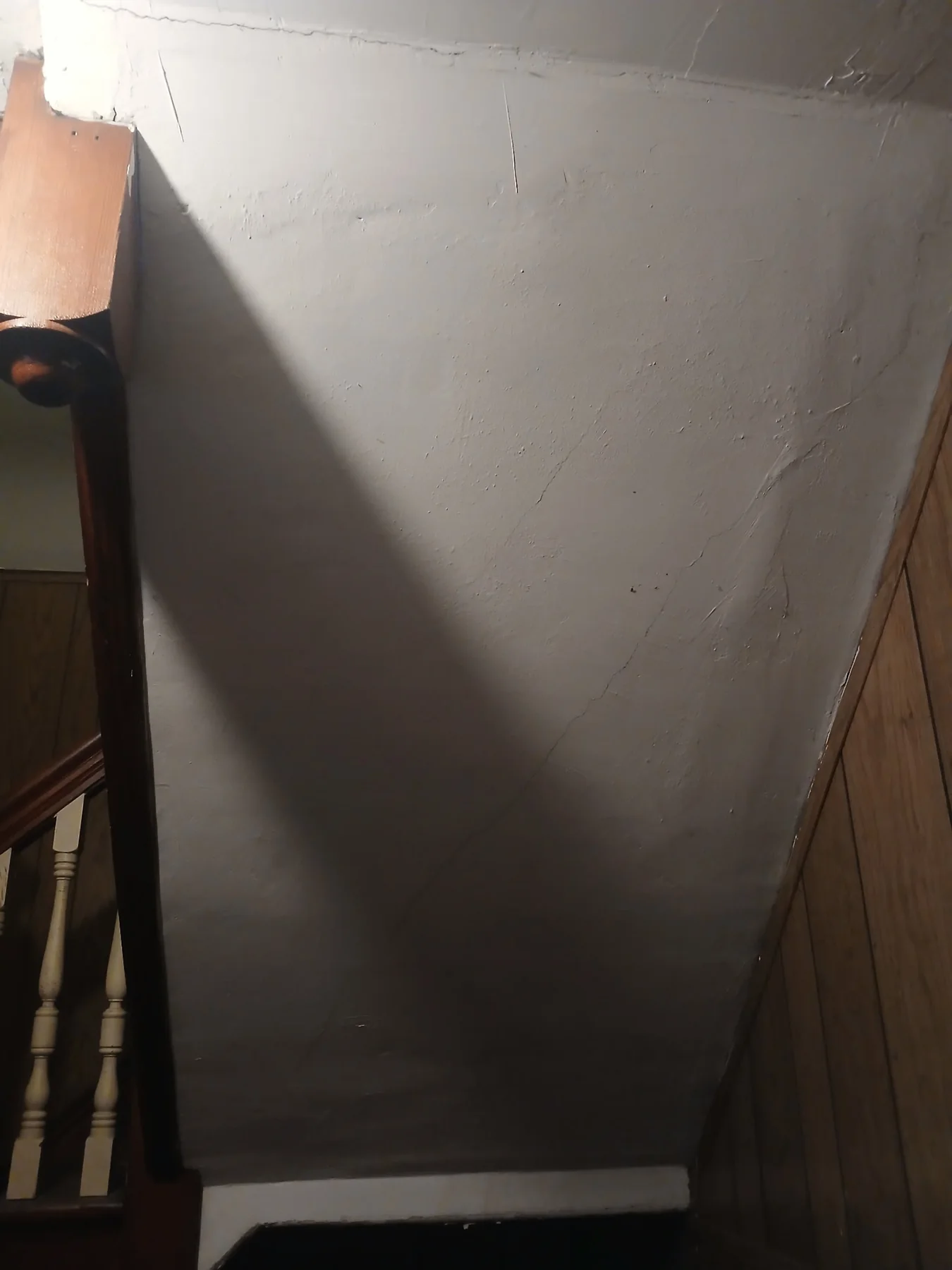 Wall beneath the staircase after preparation and painting